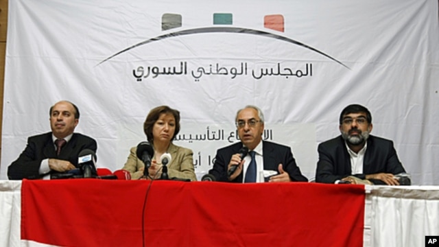 From left, Ahmed Ramadan, Bassma Kodmani, Abdulbaset Seida and Imad Aldeen Rashid speak as a group of Syrian opposition members announced a Syrian National Council in Istanbul, Turkey (File Photo - September 15, 2011).