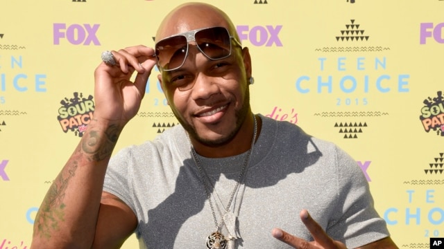 FILE - Flo Rida arrives at the Teen Choice Awards at the Galen Center in Los Angeles. 