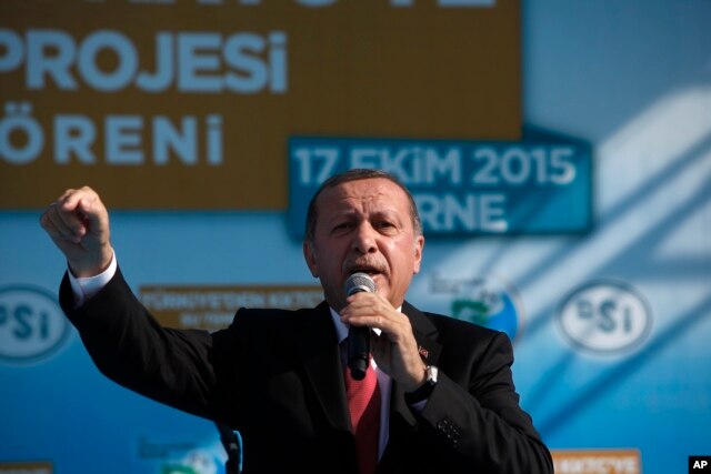 Turkish President Recep Tayyip Erdogan speaks to his supporters during an inauguration for an undersea pipeline to carry fresh water from Turkey to the breakaway Turkish Cypriot north of ethnically split Cyprus in Mirtou village, Oct. 17, 2015.