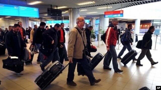 Bulgarian planes carrying Bulgarians and other foreigners - Croats, Serbs and Macedonians, Romanians, Chinese and South Koreans - arrive in Sofia, from Tripoli, Libya, Feb. 23, 2011