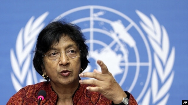 U.N. High Commissioner for Human Rights Navi Pillay gestures during a press conference in Geneva.