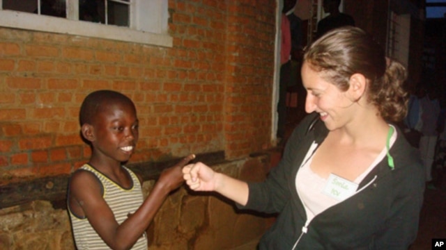 Technology helps Peace Corps volunteer Sonia Morhange, seen here in Rwanda, stay in touch with family and friends back in the United States.