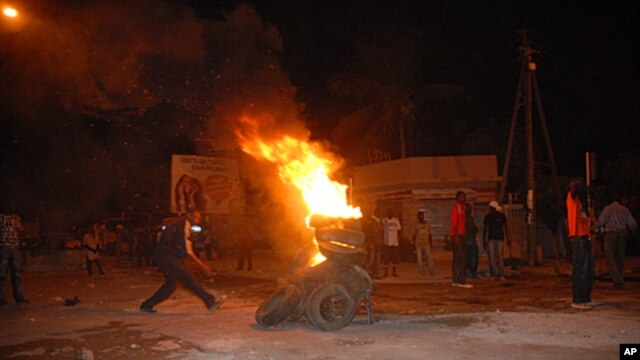 Protesters burn tires in a street after Senegal's highest court ruled that the country's increasingly frail President Abdoulaye Wade, 85, could run for a third term in next month's presidential election, in Dakar, Senegal, January 27, 2012.