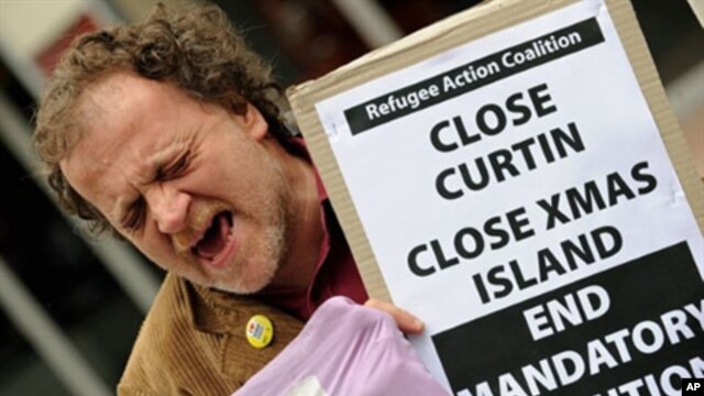 An activist from the "Refugee Action Coalition" yells out during a rally in Sydney in support of refugees (2010 File)
