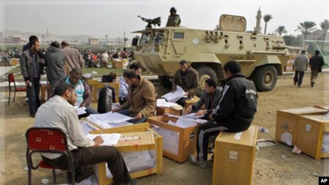 Election officials count ballots for the parliamentary elections in Cairo, Egypt,  Nov. 30, 2011