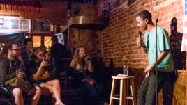 Comedian Micael Berhabe on stage at the Town Tavern (DC)