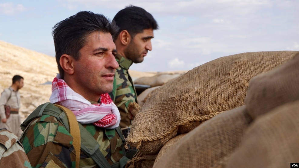 Iranian Kurdish fighters stand watch on the Bashiqa front lines, Nov. 2, 2016. Last week, there were high Kurdish casualties during an offensive on the Islamic State-held town 30 kilometers from Mosul. (J. Dettmer/VOA)