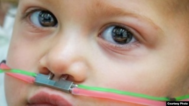 This 2-year-old child wears a pediatric nasal cannula, which delivers odors. (Credit: Ofer Perl)