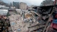 Kenyan police officers and Kenyan National Youth Servicemen search the site of a building collapse in Nairobi, Kenya, April 30, 2016.