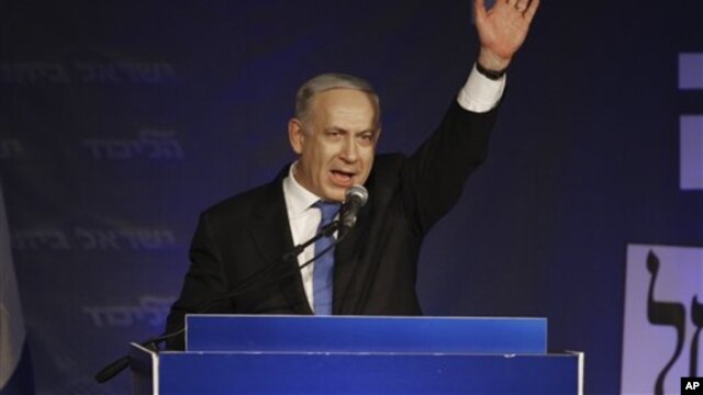 Israel's Prime Minister Benjamin Netanyahu greets his supporters in Tel Aviv, Israel, Jan. 23, 2013