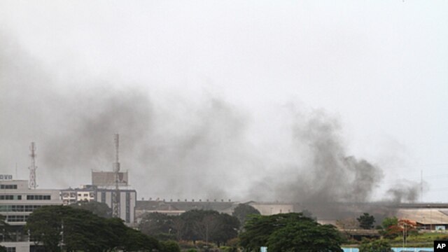 Smoke rises from the city center of Abidjan, April 2, 2011
