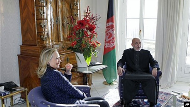 U.S. Secretary of State Hillary Rodham Clinton (L) holds private talks with Afghan President Hamid Karzai during an international conference on the future of Afghanistan, in Bonn, Germany, December 5, 2011.