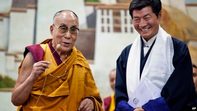 Lobsang Sangay, prime minister of the Tibetan government-in-exile, right, and the Dalai Lama visit the Tibetan Children’s Village School in Dharmsala, India, on June 5, 2014.