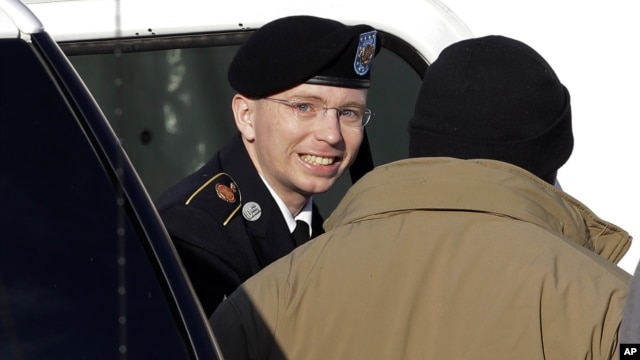 Army Pfc. Bradley Manning, center, steps out of a security vehicle as he is escorted into a courthouse in Fort Meade, Md.,  Nov. 28, 2012.