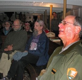 Park ranger Peter Kasin (right) leads a sea chantey sing-along aboard the 1886 sailing ship, The Balclutha.