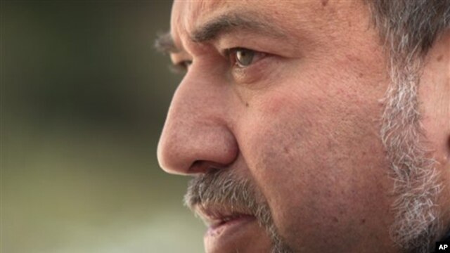 Israel's Foreign Minister Avigdor Lieberman looks on prior to his meeting with European Union foreign policy chief Catherine Ashton, not seen, in Jerusalem, Feb 15, 2011