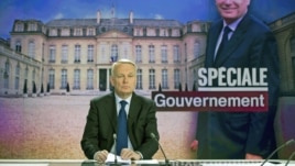 France's Prime Minister Jean-Marc Ayrault takes part in the broadcast news of French TV channel France 2, May 16, 2012 in Paris.