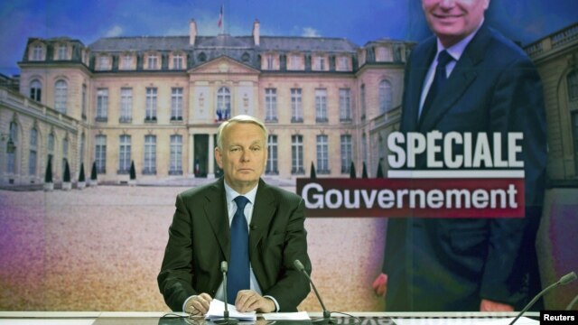 France's Prime Minister Jean-Marc Ayrault takes part in the broadcast news of French TV channel France 2, May 16, 2012 in Paris.