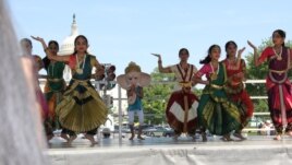 Dancers at the National Asian Heritage Festival in Washington in May, with the Capitol in the background