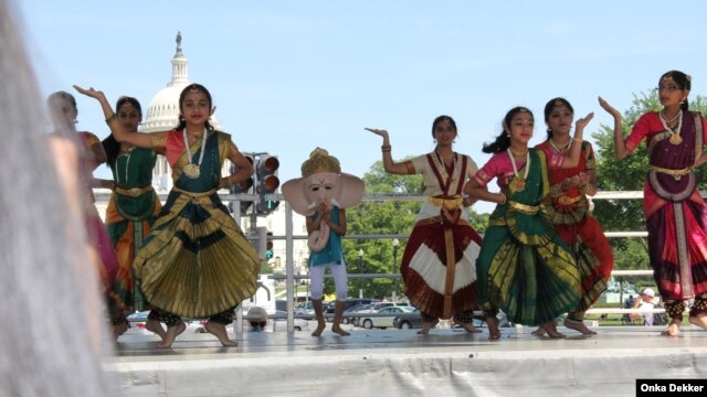 Dancers at the National Asian Heritage Festival in Washington in May, with the Capitol in the background