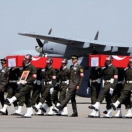 Turkish soldiers carrying the coffins of soldiers who were killed in an attack by members of the Kurdistan Workers' Party (PKK) during funerals in Van, August 18, 2011.