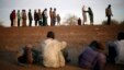 Travelers driving from Niamey, Niger, lining up to be searched at the entrance of Gao, northern Mali, Feb. 12, 2013.