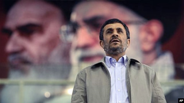 In front of portraits of the late Iranian revolutionary founder Ayatollah Khomeini (L) and supreme leader Ayatollah Ali Khamenei, President Mahmoud Ahmadinejad joins a ceremony commemorating International Day Against Drug Abuse, at the Azadi [Freedom] spo