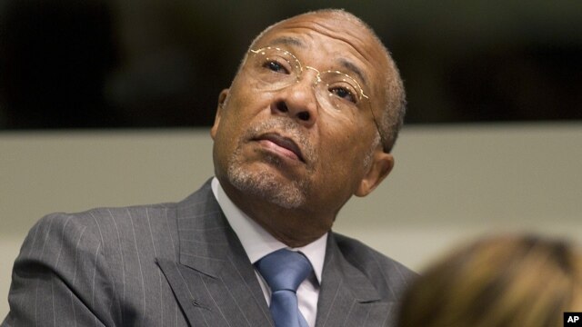 Former Liberian President Charles Taylor looks up to the public gallery as he waits for the start of his sentencing hearing in Leidschendam, near The Hague, Netherlands, May 16, 2012