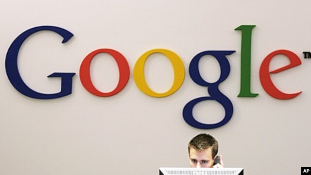 Google receptionist Lee Stimmel works at the front desk in the company's office in New York, October 2, 2006 (file photo).
