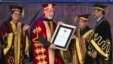 Afghan President Hamid Karzai receives an honorary degree from his Indian counterpart Pranab Mukherjee, second right, at the Lovely Professional University in Jalandhar, India, May 20, 2013.