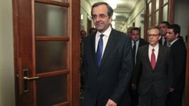 Newly appointed Greek Prime Minister Antonis Samaras arrives for the first cabinet meeting of his government at the parliament in Athens, June 21, 2012.