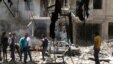 People inspect the damage at a site hit by airstrikes, in the rebel-held area of Aleppo's Bustan al-Qasr, Syria, April 28, 2016. 
