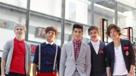 Members of British-Irish band One Direction pose after performing on NBC's "Today" show in New York March 12, 2012.