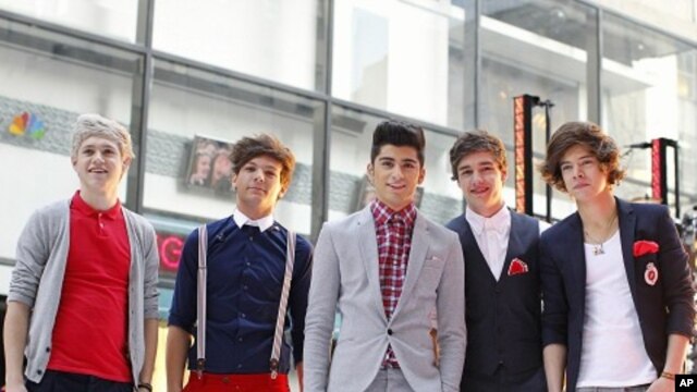 Members of British-Irish band One Direction pose after performing on NBC's "Today" show in New York March 12, 2012.