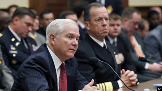 U.S. Secretary of Defense Robert Gates  (L) and Chairman of the Joint Chiefs of Staff Adm. Mike Mullen testify at a House Armed Services Committee hearing on Operation Odyssey Dawn and U.S. Military Operations in Libya, Mar 31 2011