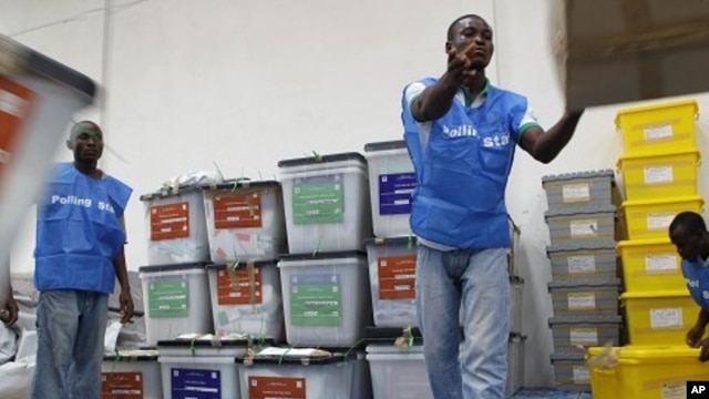 Staff organize ballot boxes from polling stations in Monrovia, Liberia, Oct. 12, 2011.