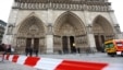 French policemen cordon off in front of Paris' Notre Dame Cathedral following the evacuation of the after a man shot himself dead in front of the altar, May 22, 2013.