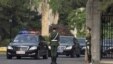 A car, second from left, believed to be carrying North Korean envoy Choe Ryong Hae, is escorted by a convoy of cars as it leaves Beijing's Diaoyutai State Guesthouse, May 24, 2013. 