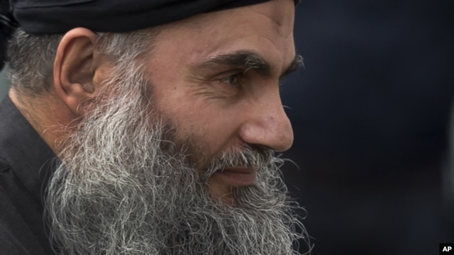  Abu Qatada arrives back at his residence in London after being freed from prison, November 13, 2012. 