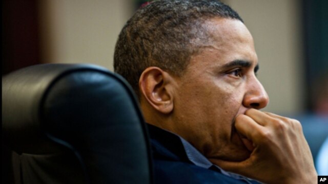 President Barack Obama listens during one in a series of meetings discussing the mission against Osama bin Laden, in the Situation Room of the White House, May 1, 2011.