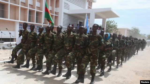 Somali government forces march during a parade to celebrate the 53rd anniversary of the national army, in the capital Mogadishu, April 12, 2013.