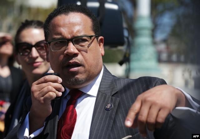 FILE - U.S. Rep. Keith Ellison (D-MN) (R) speaks during a news conference.