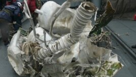 An undated image released by South Korea's Defense Ministry in Seoul, shows that a piece of wreckage of North Korea's Unha-3 (Milky Way 3) on a navy vessel of South Korean navy. 