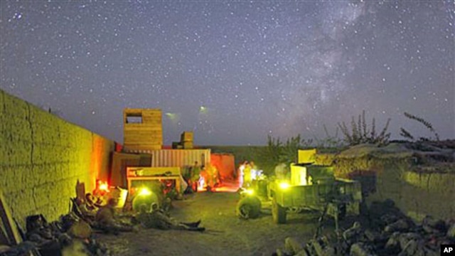 US Marines lie down inside a small patrol base during a pause in an all night mission in Helmand province, southern Afghanistan, October 2009. (file photo)