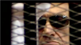 Former Egyptian president Hosni Mubarak seen in the defendant's cage as a judge reads a verdict, June 2, 2012.  