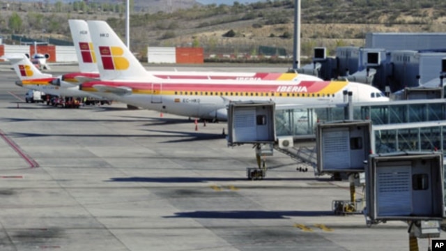 Planes of Spanish airline Iberia are parked at the Madrid's Barajas airport, at the start of a series of one-day strike by Iberia pilots, April 9, 2012.