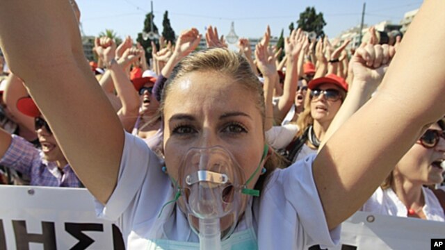 A nurse shouts slogans during a protest by hospital staff in Athens, October 13, 2011.