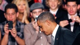 President Barack Obama walks off the stage after speaking about the Aurora, Colorado shooting in Fort Myers, Florida, July 20, 2012.