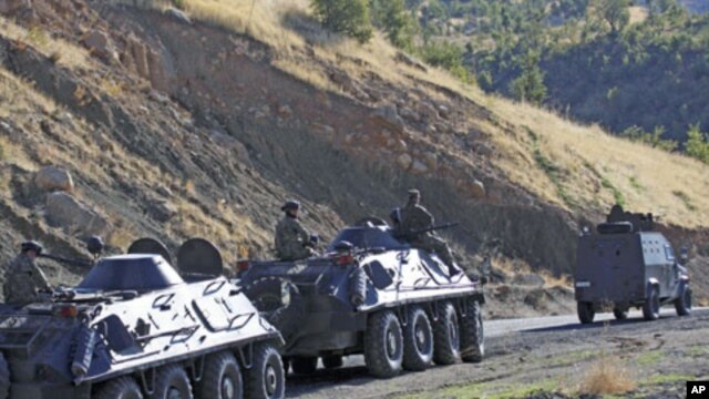 Turkish soldiers in armored vehicles patrol in Sirnak province on the Turkish-Iraqi border, October 21, 2011.