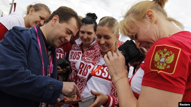 Russia's Prime Minister Dmitry Medvedev meets with members of the Russian Olympic team in London this summer. He recently called for a ban on smoking.